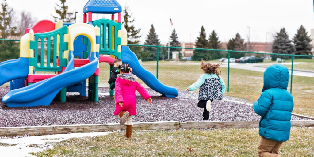 Students running to outside school playground.