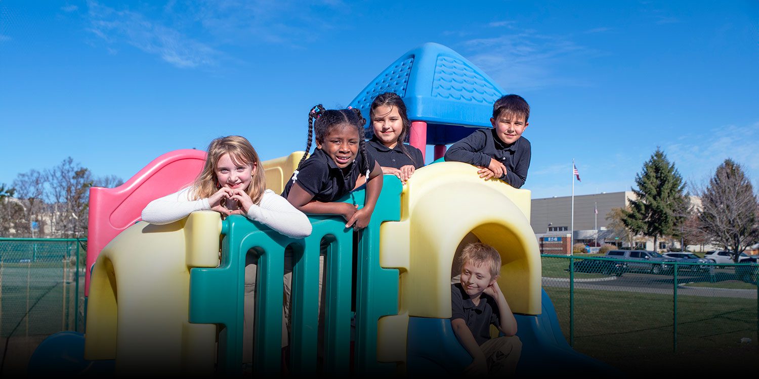 Group of smiling students at the playground